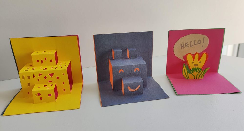 Three little colourful popups. Left to right: abstract cheese, happy bear, hello flower. #BCBF2025