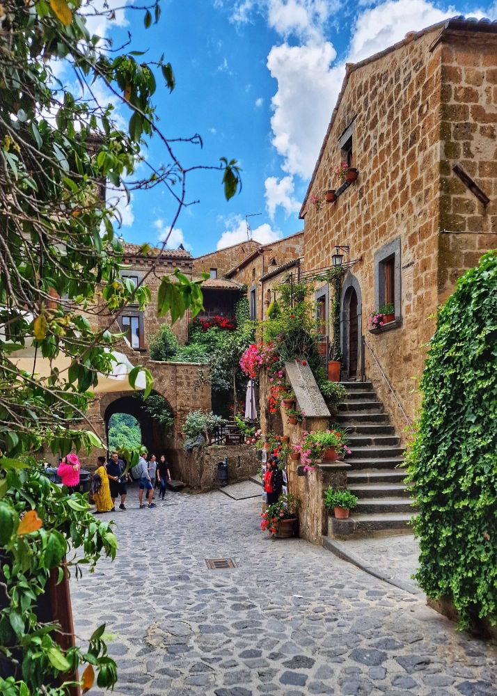 Civita di Bagnoregio, the "dying city," is breathtaking! 🤩 Perched dramatically atop a tufa hill and connected by a footbridge, it's like stepping back in time. So worth the walk!