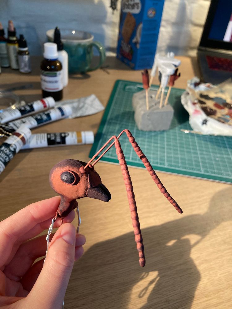 Progress pic of the ant doll’s head with its antennae attached. It’s painted different shades of brown with red hints