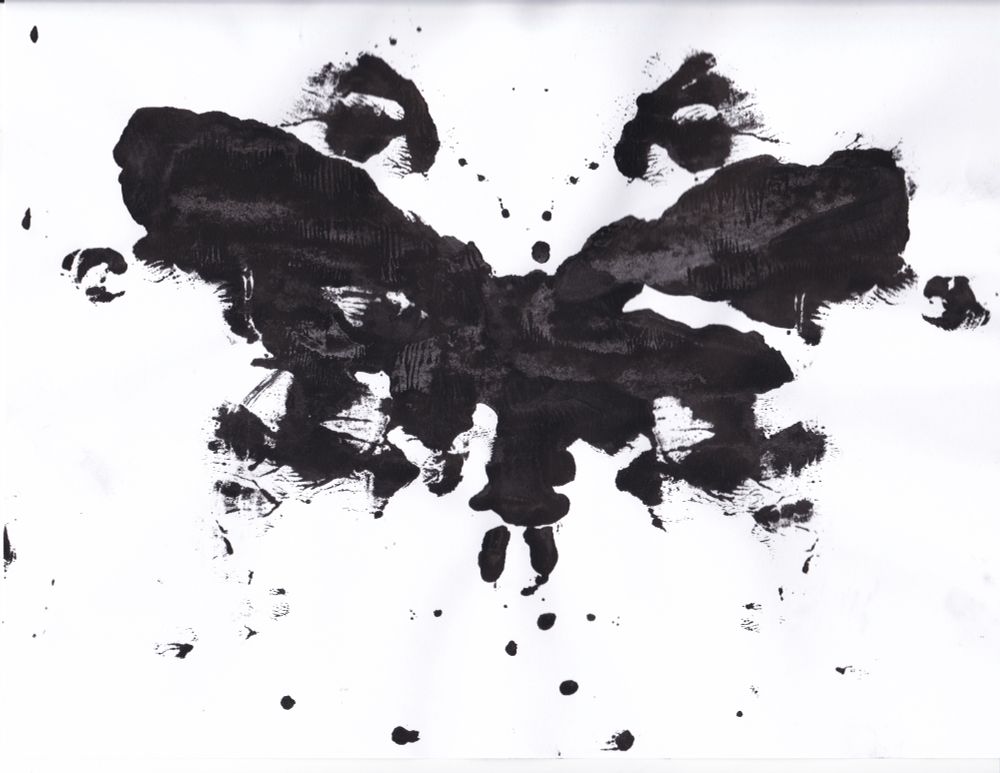 Scan of a black-and-white image. Inkblots on paper. What looks like a pair of eyes peaks above a sort-of butterfly-like image; the lower abdomen of the insect seemingly ending in pincers. The wings are a grey-black irregular pattern on the wings and thorax almost looks like a pair of distorted eyes, and eye-like orbs float aside each wing like afterimages. 

The eyes above all this insect-like imagery look very human, calm, their tear-ducts neatly touched by small dots of what could be antenna from the mask-like butterfly. 