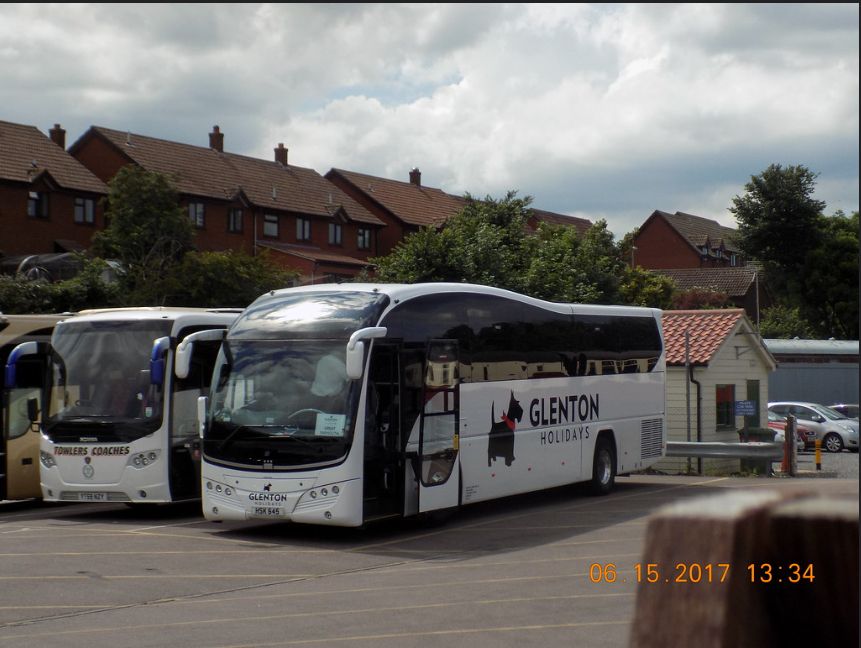 White coach in car park
