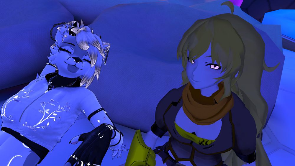 a VRChat photo of Yang Xiao Long and a white-and-purple canine woman in a white hoodie. Both are smiling happily, and the canine's eyes are closed