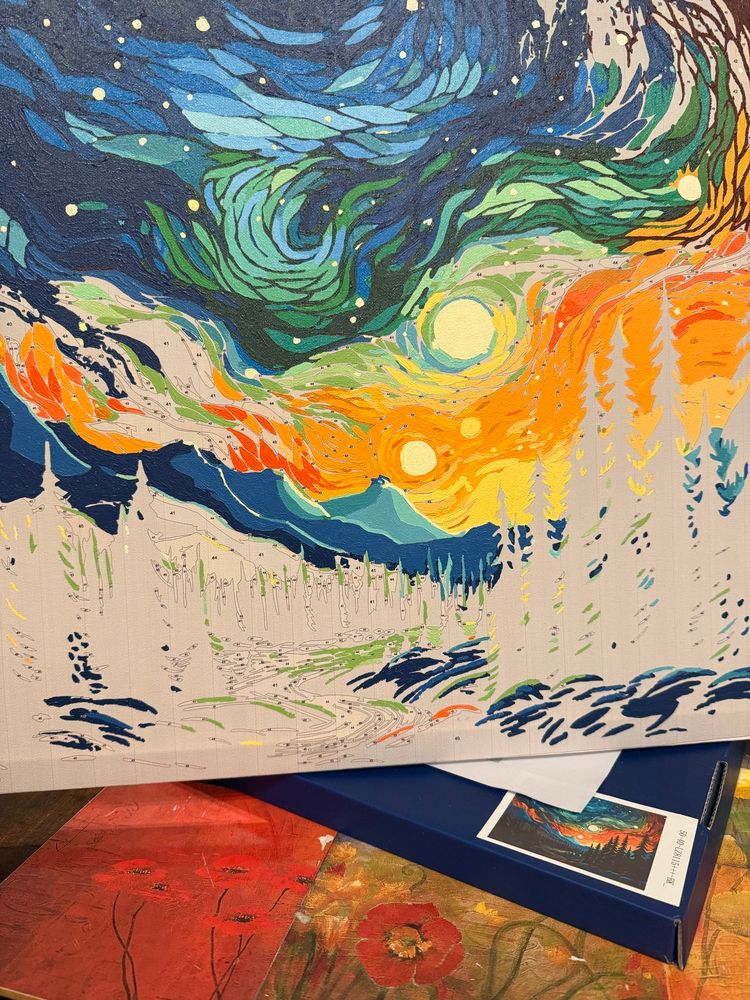 Paint by numbers canvas with sunset and mountains partially painted