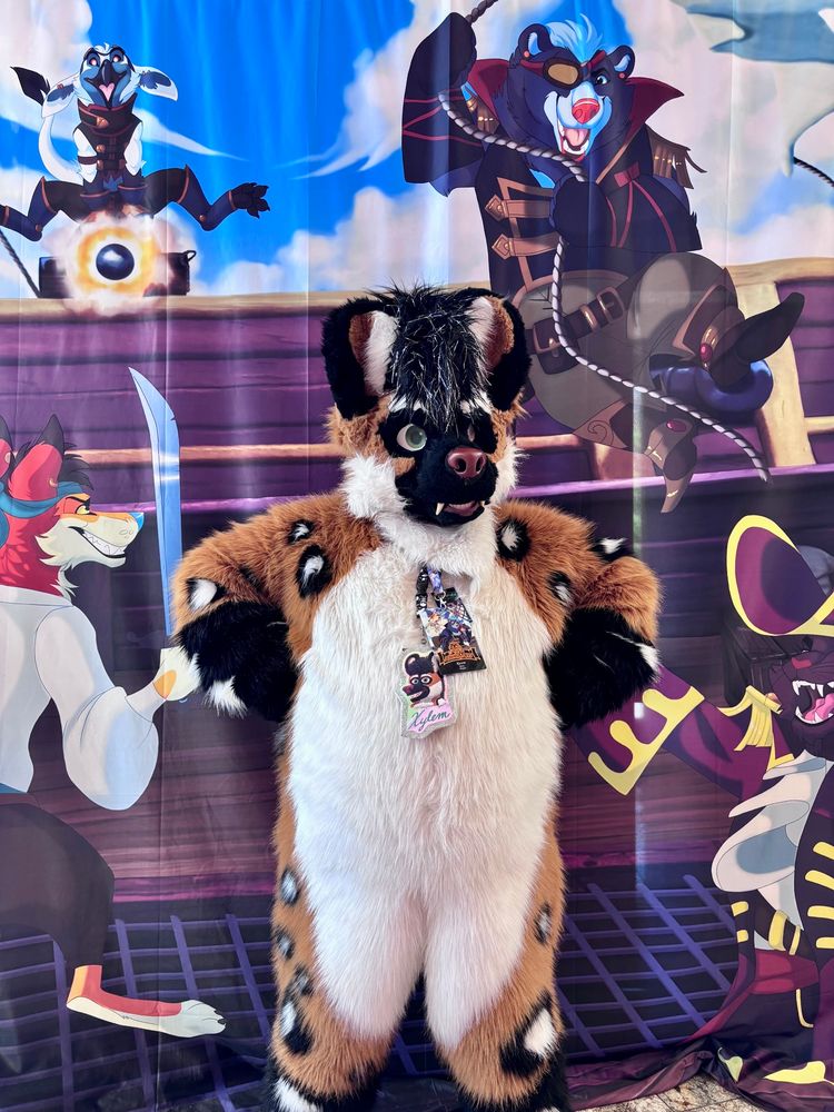 A gnoll in front of a tapestry depicting acts of furry piracy