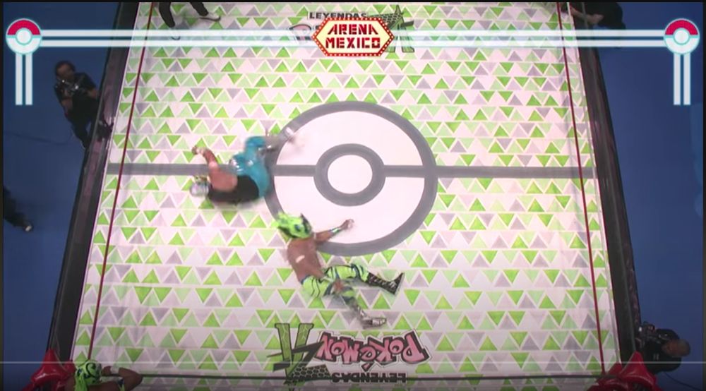 Pokemon themed wrestling mat with a green & grey triangle pattern and a Pokeball in the middle