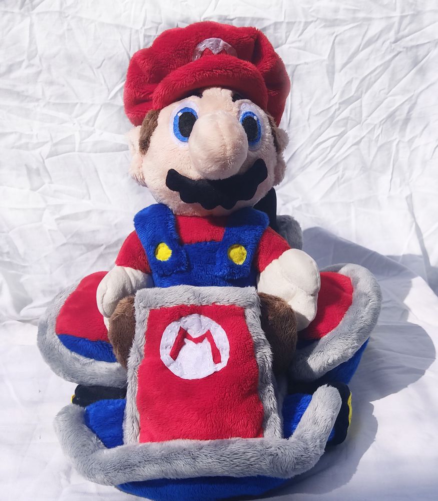 Mario Mario in his gokart from game numbered 7 