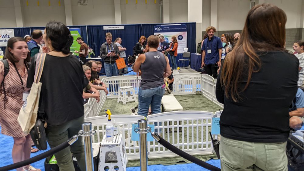 MathFest attendees playing with puppies