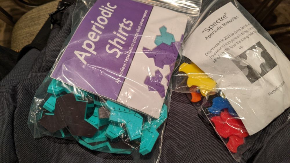 Plastic and foam versions of aperiodic monotiles (shirt/hat and spectre), available at mathartfun.com