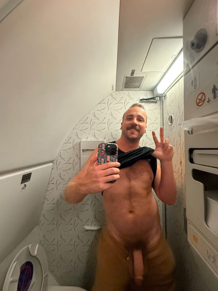 Airplane bathroom mirror selfie with my shorts pulled down below my junk