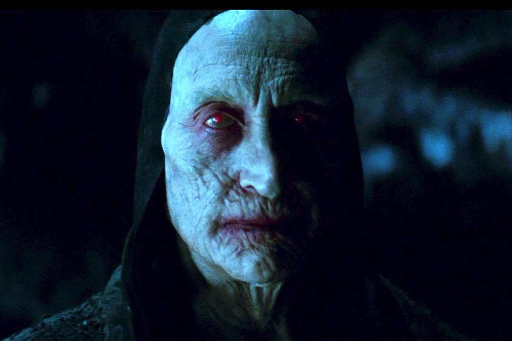 charles dance as the Master Vampire from the Luke Evans masterpiece, Dracula Untold. this is the guy that turns Vlad into Dracula, so really he’s dracula’s daddy. he is a bone-pale, ancient and decrepit man with sunken blood-red glowing eyes, and sickly mauve skin on his lips and eyelids. he wears a goofy little black hood
