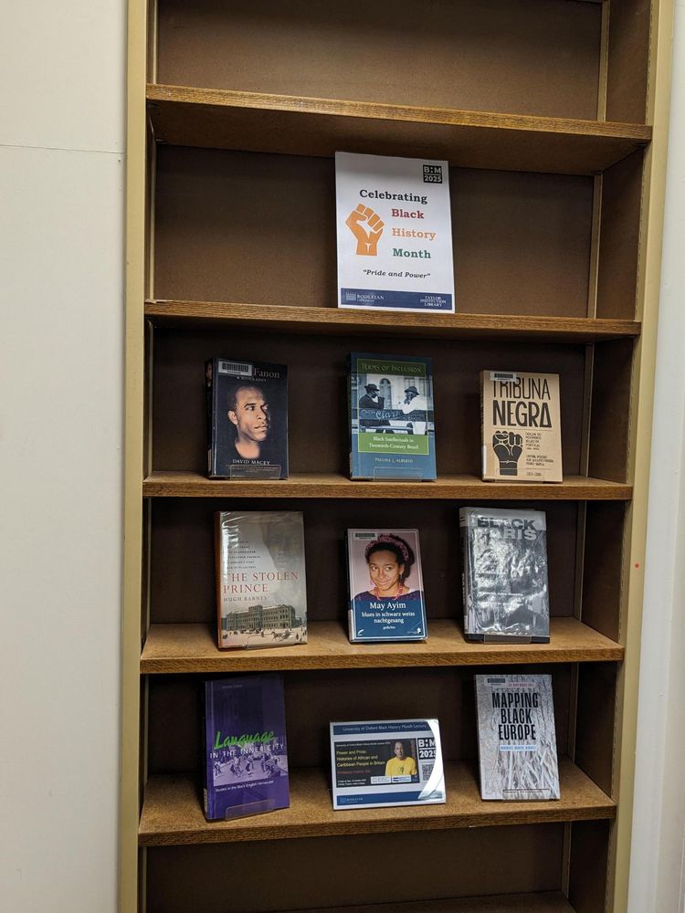 A Black History Month book display, showing a poster reading 'Celebrating Black History Month - Pride and Power', and the following books:

Frantz Fanon : a biography by David Macey.
Terms of inclusion : Black intellectuals in twentieth-century Brazil by Paulina L. Alberto.
Tribuna Negra : origens do movimento negro em Portugal (1911-1933) by Cristina Roldão, José Augusto Pereira e Pedro Varela.
The stolen prince : Gannibal, adopted son of Peter the Great, great-grandfather of Alexander Pushkin, and Europe's first black intellectual by Hugh Barnes.
Blues in schwarz weiss nachtgesang : Gedichte by May Ayim.
Black Paris : the African writers' landscape by Bennetta Jules-Rosette ; foreword by Simon Njami.
Language in the inner city; studies in the Black English vernacular.
Mapping Black Europe : monuments, markers, memories by Natasha A. Kelly, Olive Vassell (eds.)


