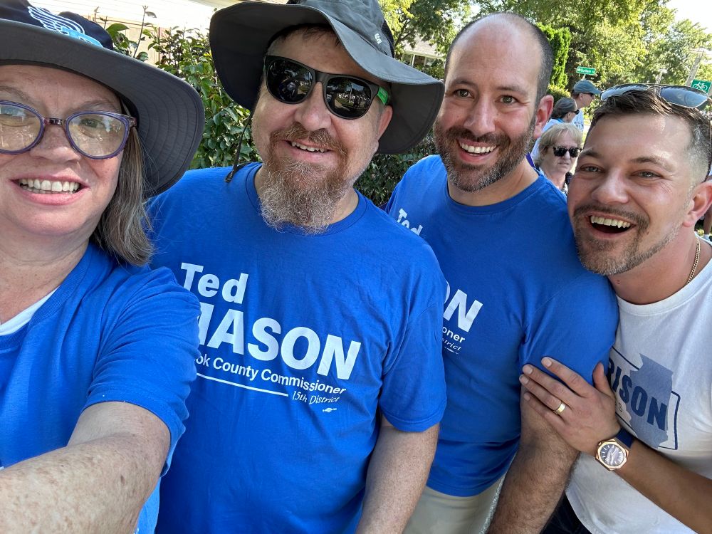 Committeeman Ted Mason, Cook County Commissioner Kevin Morrison smiling with two volunteers at the Schaumburg Labor Day parade in Illinois 