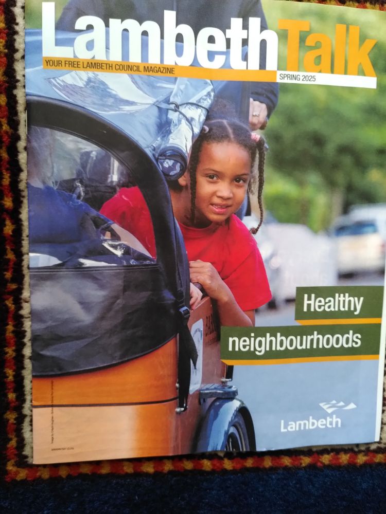 Child travelling in style in a cargo bike on an urban street