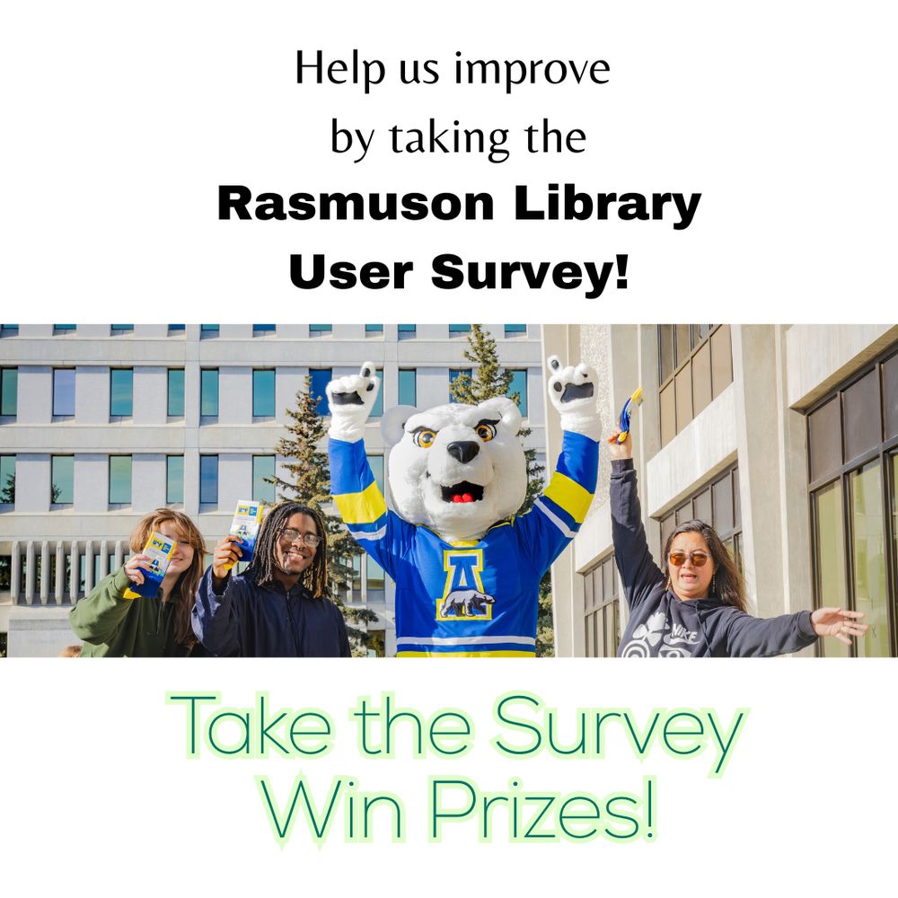 UAF Nanook mascot with people outside of the library