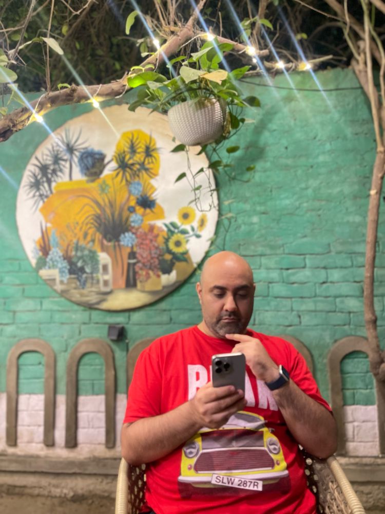 Philosopher musing. Or texting. 