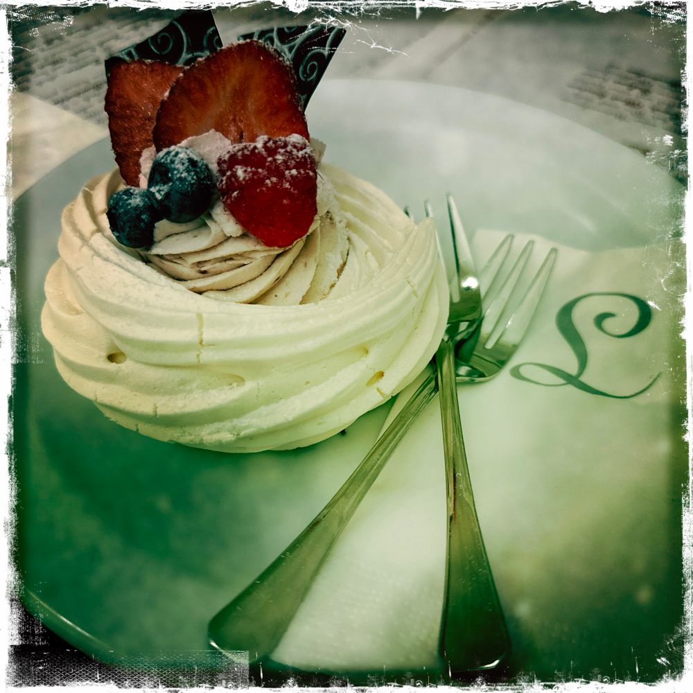 The Pavlova at Café Louvre in Prague included a creamy custard with strawberries and blueberries along with chocolate shards. 