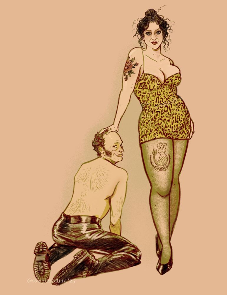 Original character Lila, a woman with messy curly hair tied up in a bun, poses wearing a short leopard print dress, her hand propped on her husband Roddy’s head. Roddy, a balding man with sideburns, kneels next to her in leather pants and boots. Both have knowing grins. 