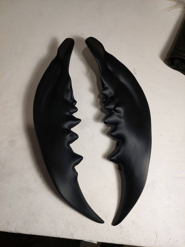 A pair of large insect-style mandibles printed from black plastic.