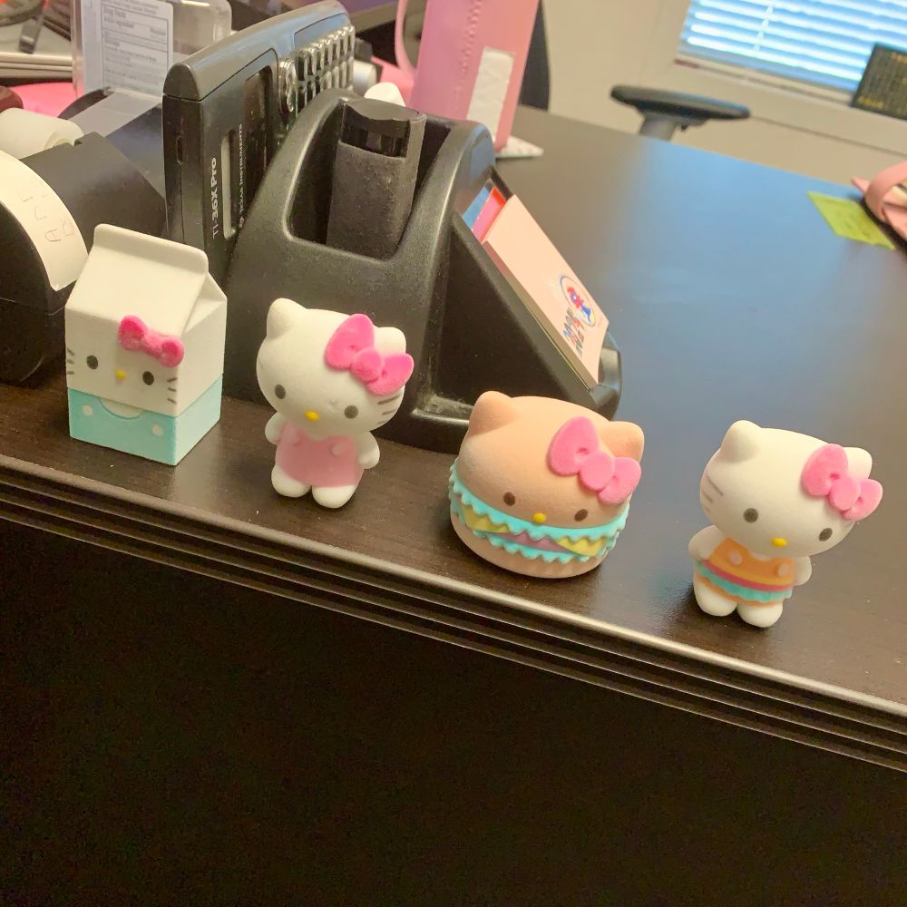 Hello Kitty figurines on a desk