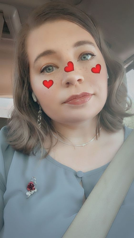 Picture of me dressed up for a wedding with a Snapchat filter 