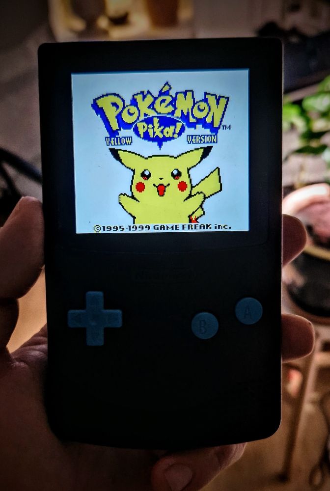 Gameboy displaying pokemon yellow