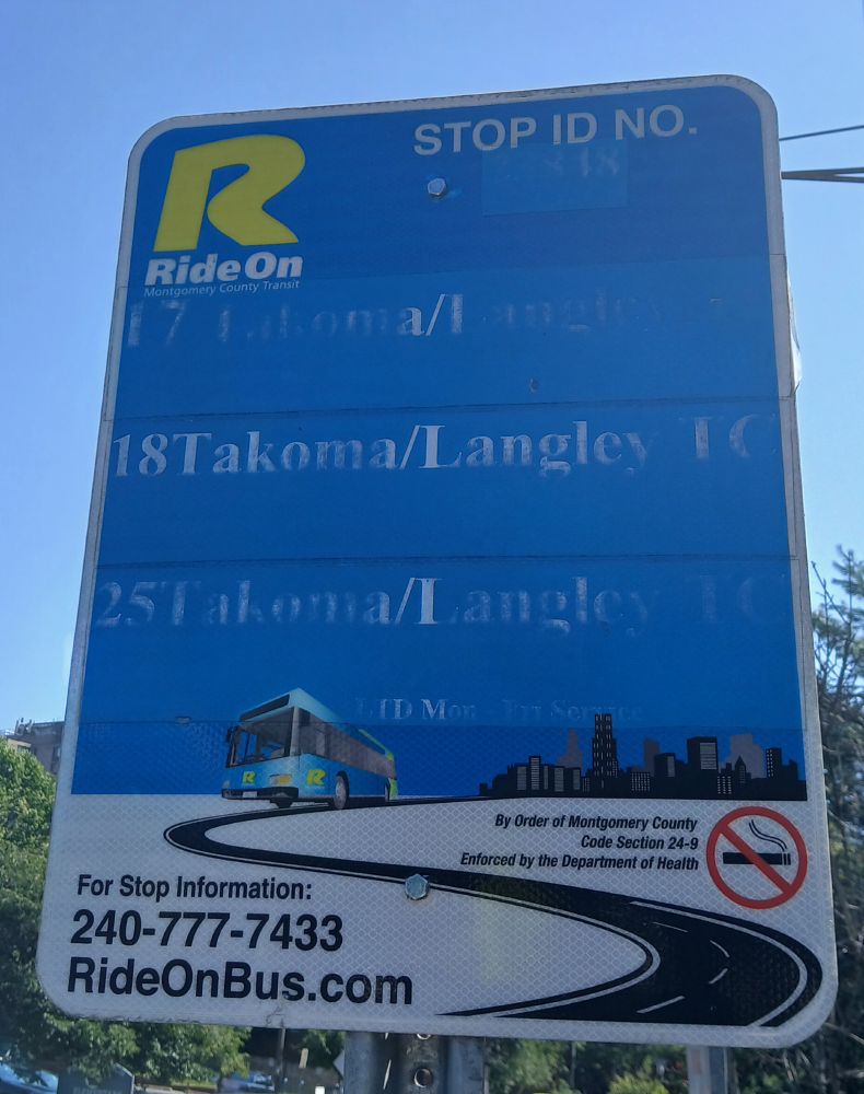 Closeup of a badly-worn bus RIde On bus stop sign including the text below, from June 24, 2025.

STOP ID NO. 23848.

17 Takoma/Langley TC.

18 Takoma/Langley TC.

LTD Mon-Fri Service.