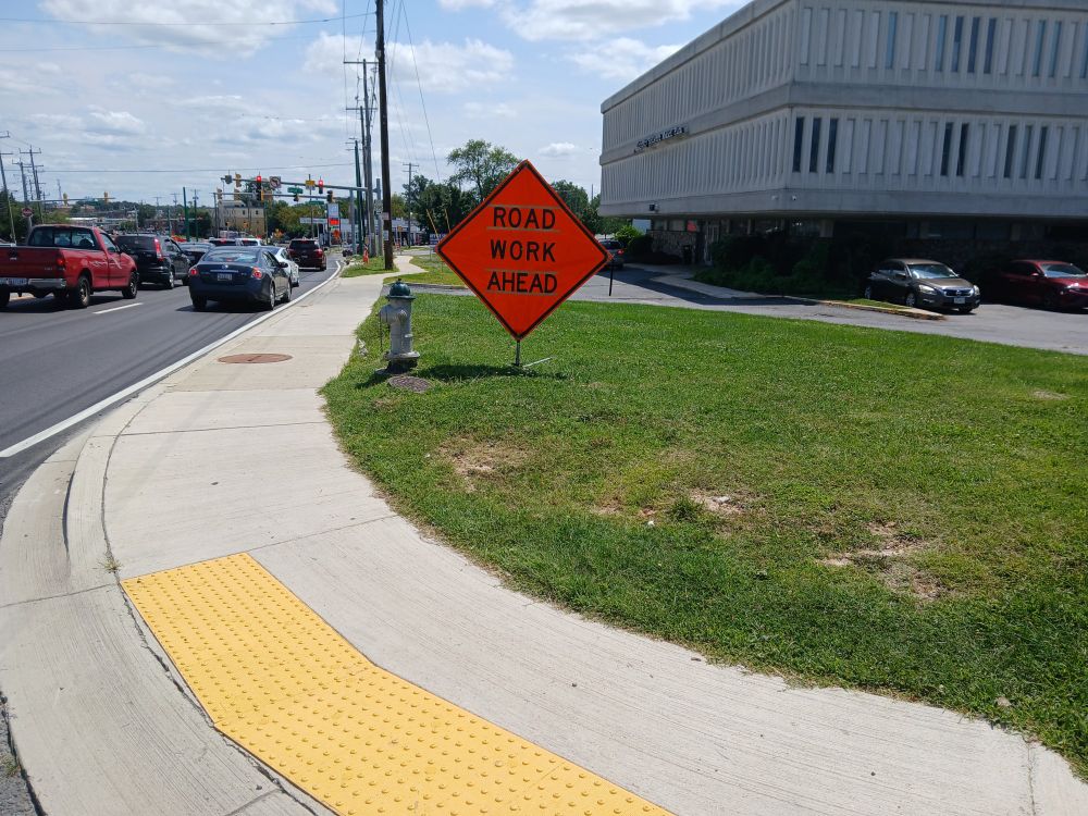 Just outside Takoma Park, Maryland, view east along south side of University Boulevard from Forston Avenue. No school crossing signage is visible.