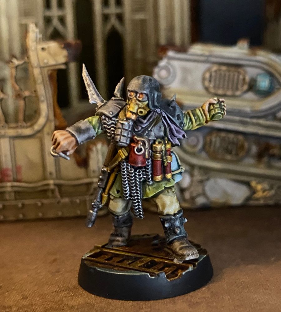 Traitor Guardsman with gas mask ready to throw a hand grenade 