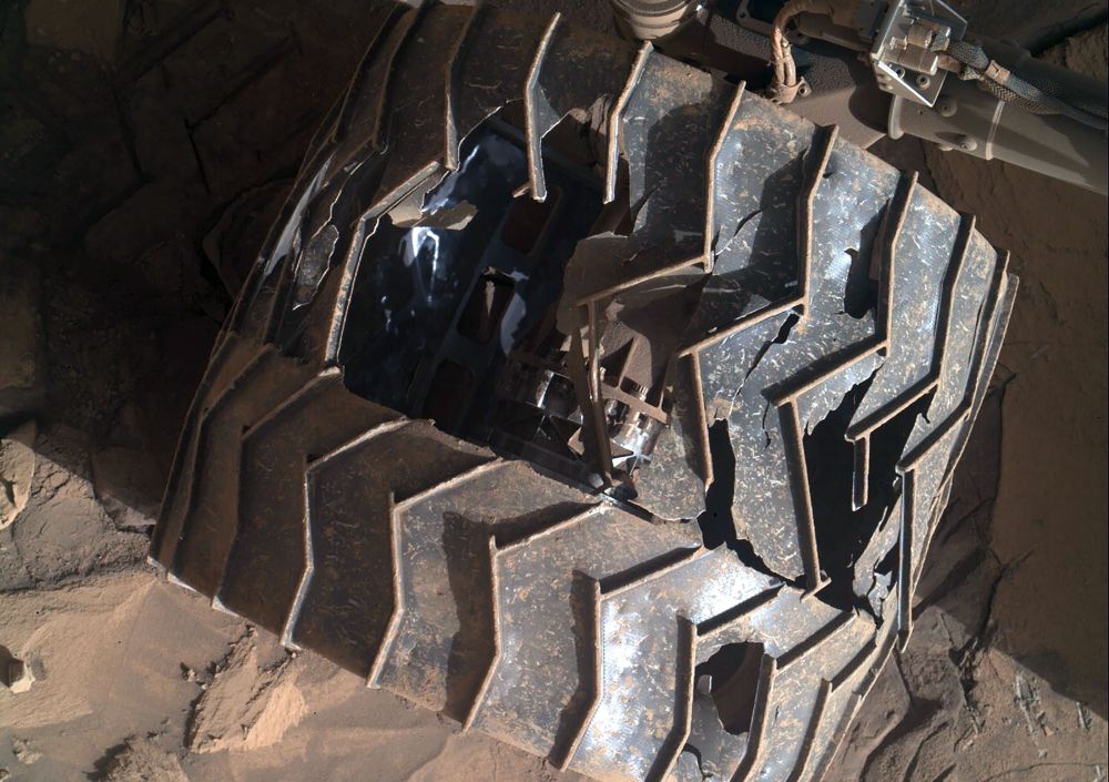 A slightly-damaged and worn wheel of a Mars rover (JPL / NASA)