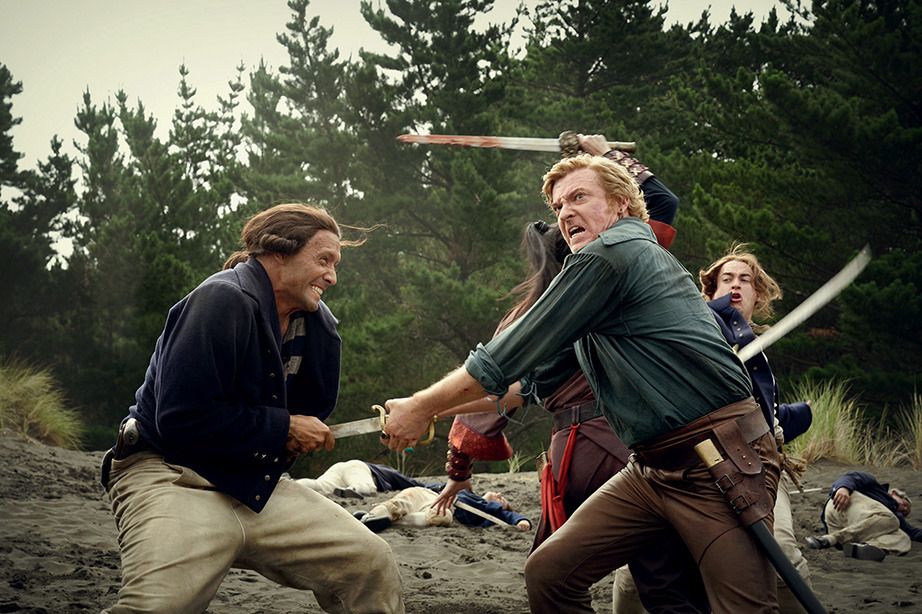 Picture of Stede Bonnet in S2 E8 of our flag means death. He is looking off screen where he can see Edward yelling for him. He is currently stabbing a colonizer in the gut with his sword while Zheng behind him is cutting the crap out of people. 