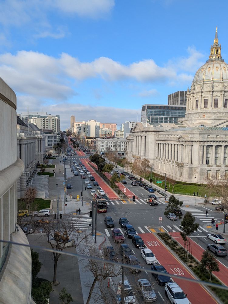 cityscape from alternate angle, showing wide street