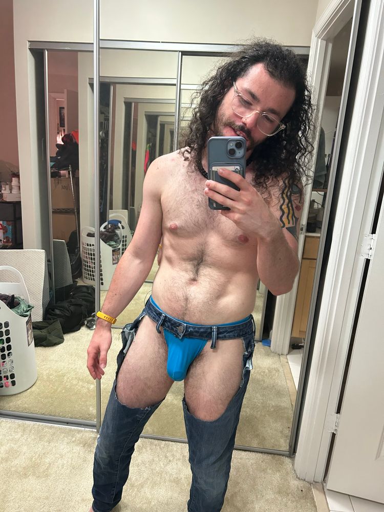 Bauhaus in blue briefs and DIY denim chaps front view