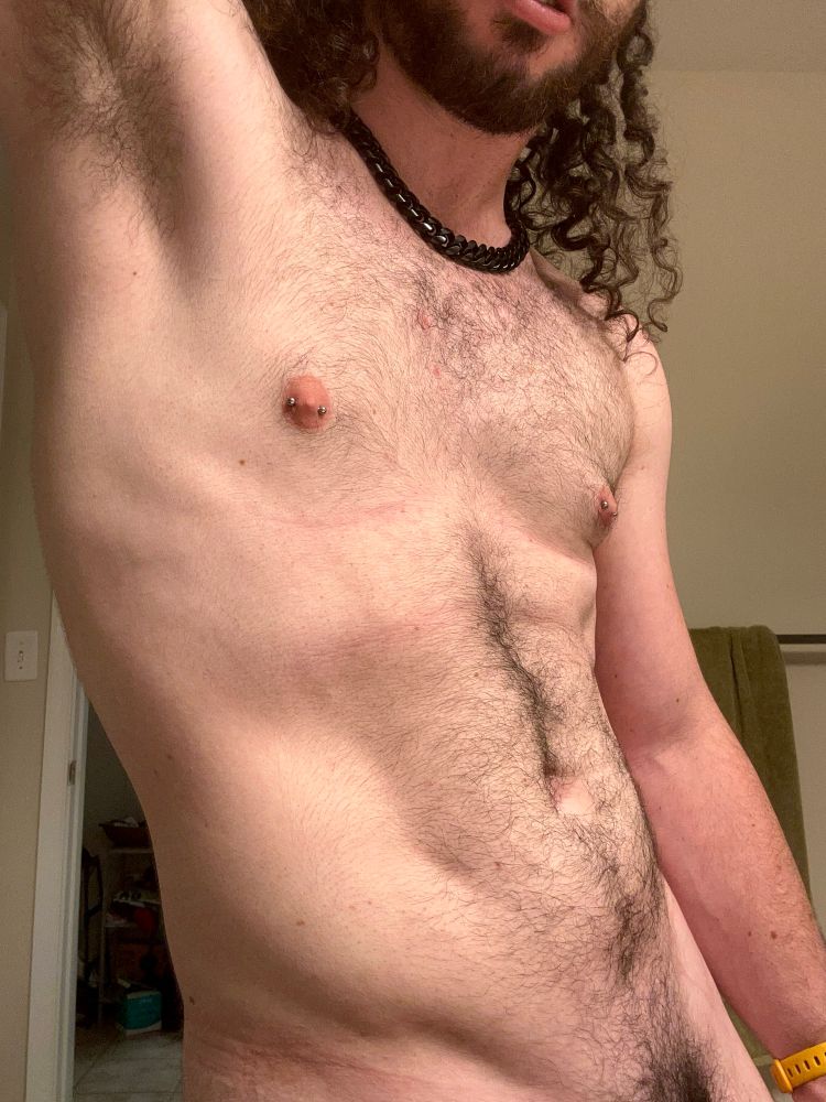 Bauhaus’s torso angles and flexing with their arm raised to show off their armpit