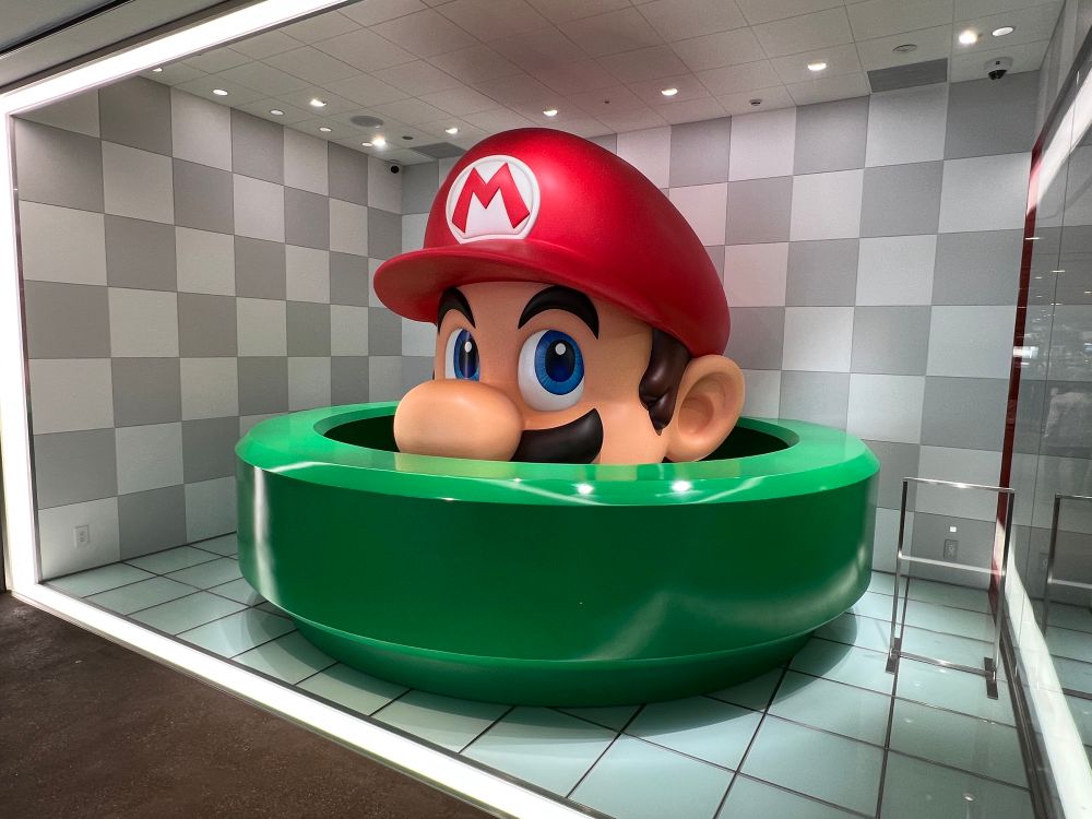 Giant Mario sticking his head out of a pipe
