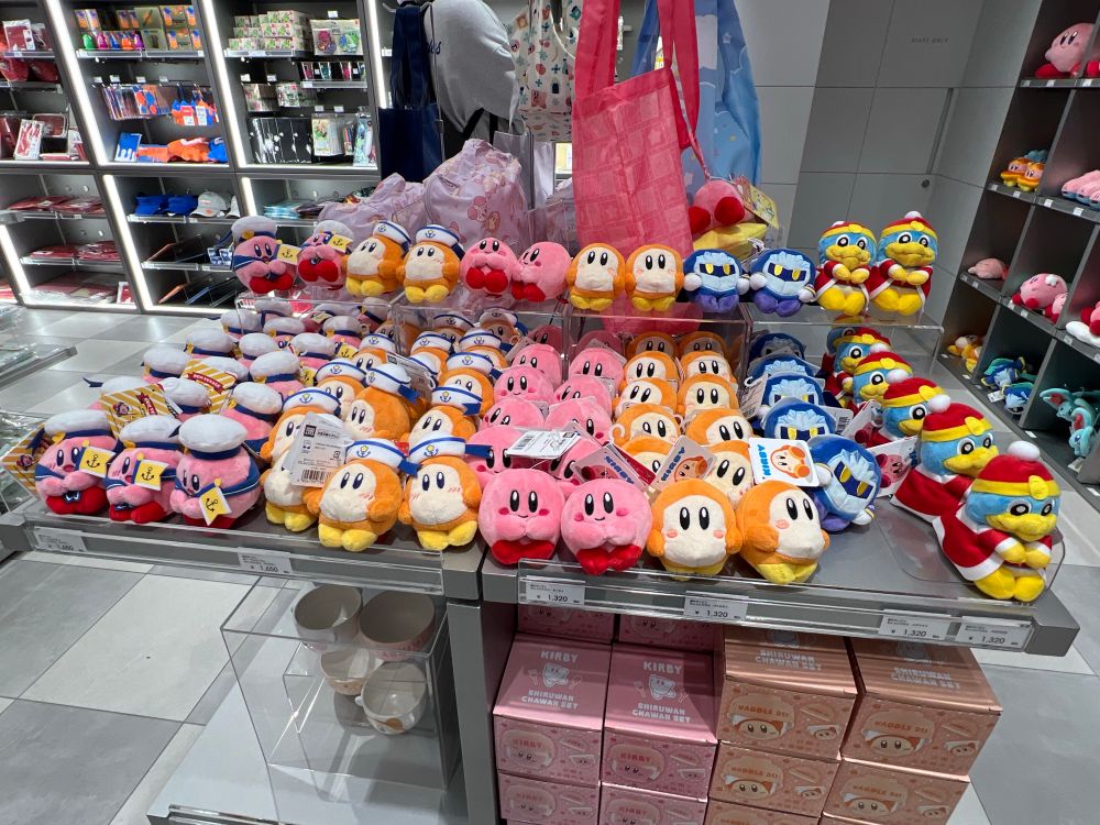 Table full of various Kirby plushes