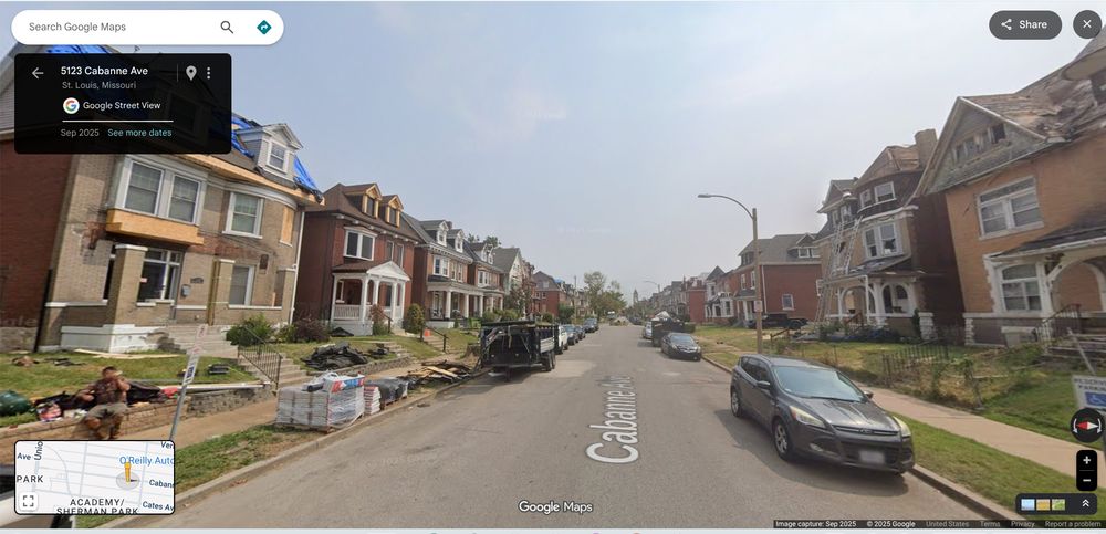 September 2025 Google streetview of a block on Cabanne Avenue in the Academy neighborhood lined with 2.5 story brick homes built circa 1900. Work  on several damaged homes is visible. There are no street trees.