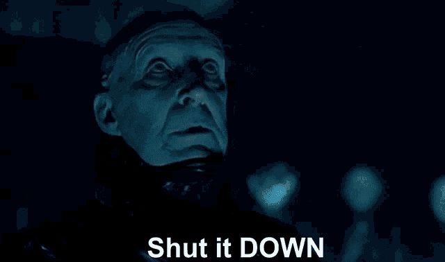 Image from Dark City of a pale older man yelling, “Shut it DOWN.”