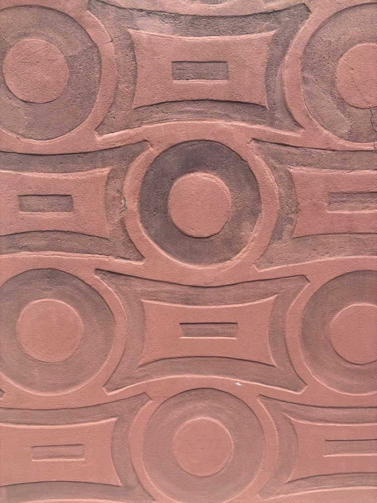 Wall on a house in Warsaw with tessellating pattern.