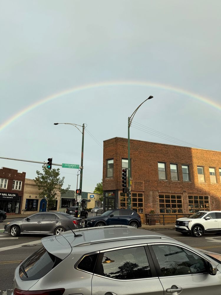 A rainbow arcs over the Sacramento and Milwaukee intersection.