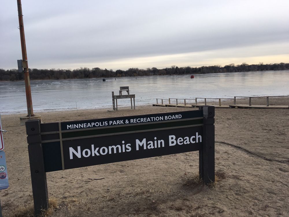Beach and frozen lake. 