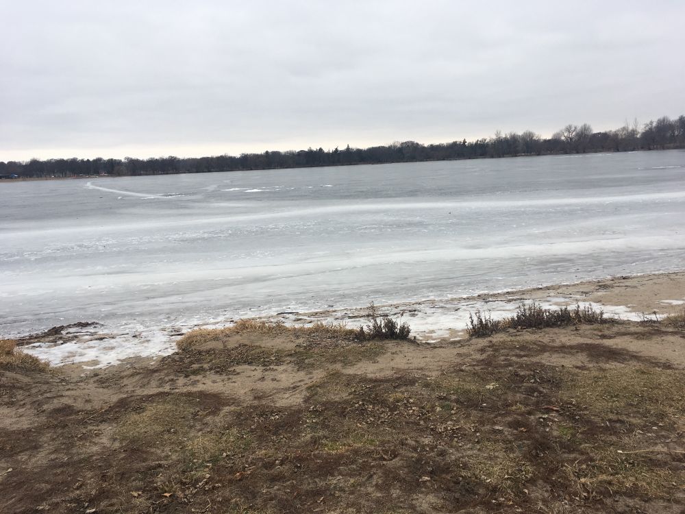 An iced over Lake and gray sky. 