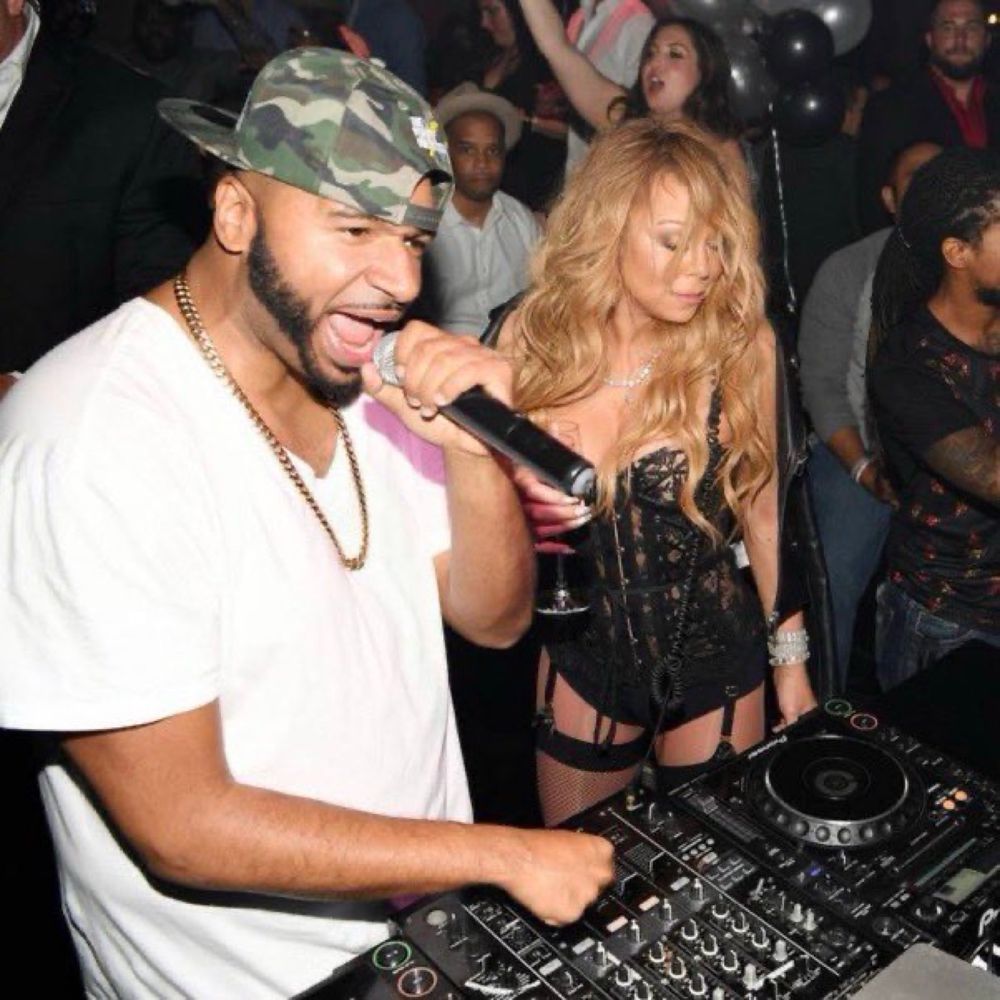 drunk mariah behind a dj booth 