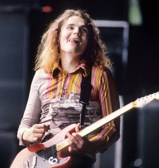 Picture of 1990s era billy Corgan when he has long wavy blonde hair 