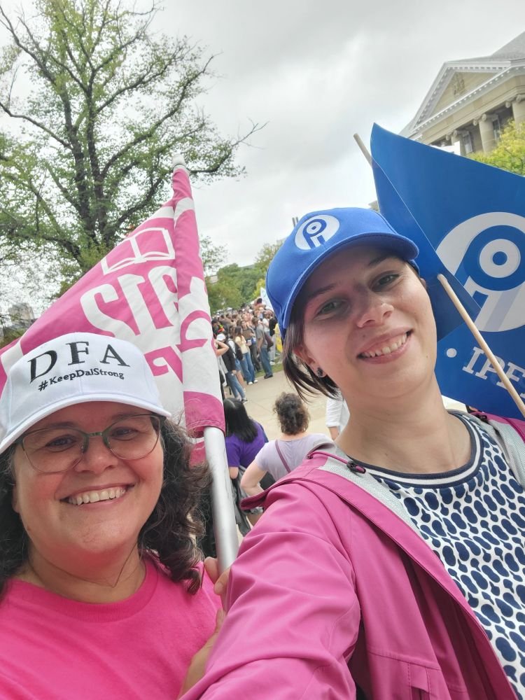 Selfie of two members carrying their union flags 
