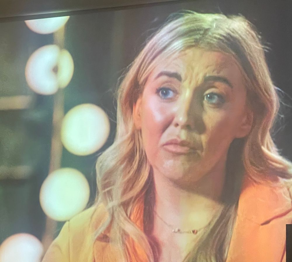 Blond woman making weird face