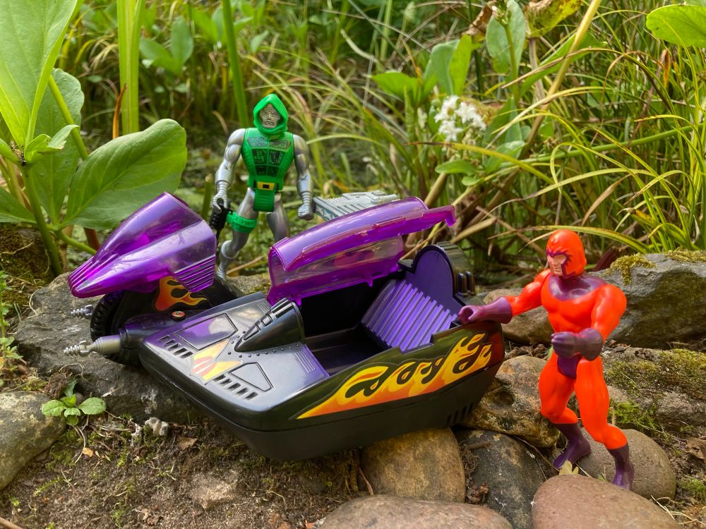Secret Wars Doom Cycle - a futuristic black motorcycle and sidecar with purple glass canopies and fearsome flame decos 