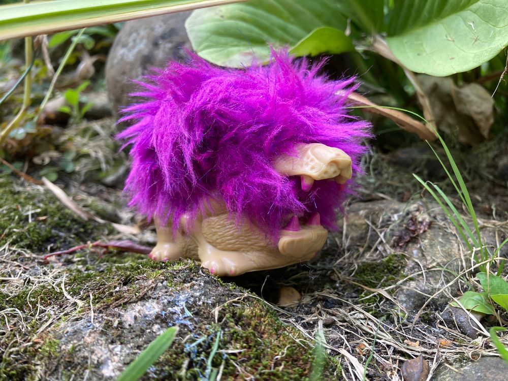 Rock Lords Narlilion a troll-like lion beast with a purple mane 