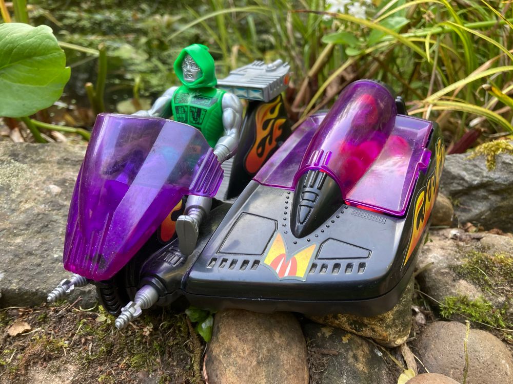 Doctor Doom starts the engine as Magneto gets comfortable in the sidecar 