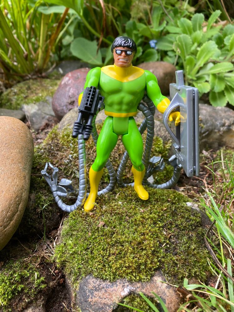 Secret Wars Doctor Octopus - a classic green & yellow Doc Ock design with his tentacles coming out of his flanks. He’s wielding a Secet Wars double-barrelled blaster and silver shield. All those arms and not one could give him a decent haircut 