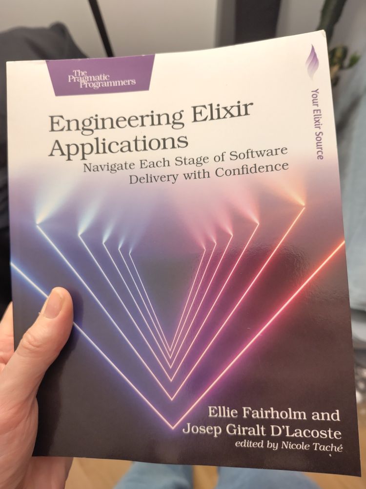 A photo of the front cover of Engineering Elixir Applications, by Ellie Fairholm & Josep Giralt D'Lacoste